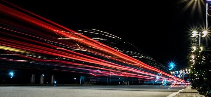 Time lapsed cars passing through the road during night time Time lapsed cars passing through the road during night time